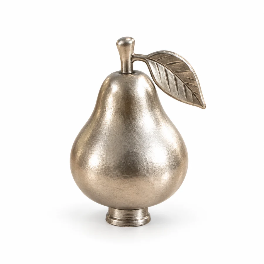 Concept: a silver pear knob with a leaf on a white background